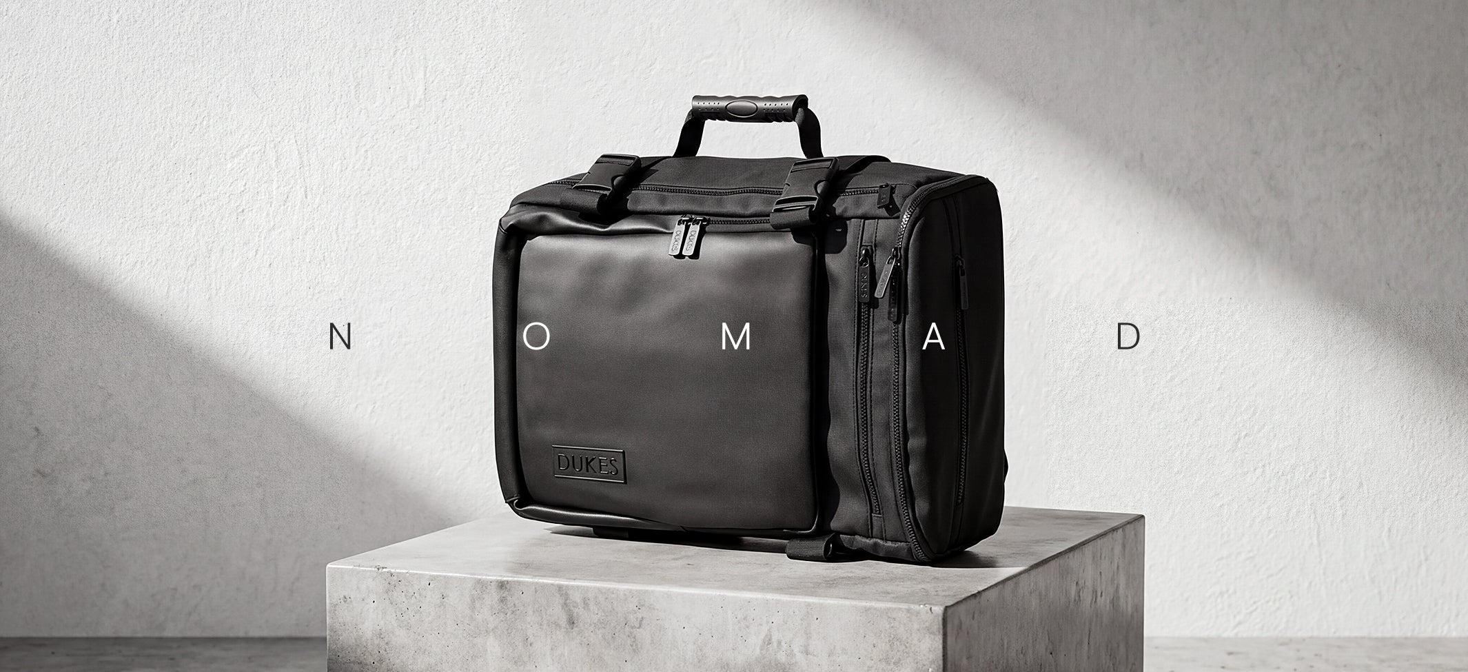 NOMAD travel bag feature hotspot — switch modes waterproof build pack capacity